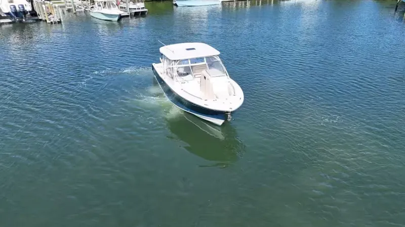 Slide: The Image of 2018 Grady-White Freedom 307 boat on calm water. - 4