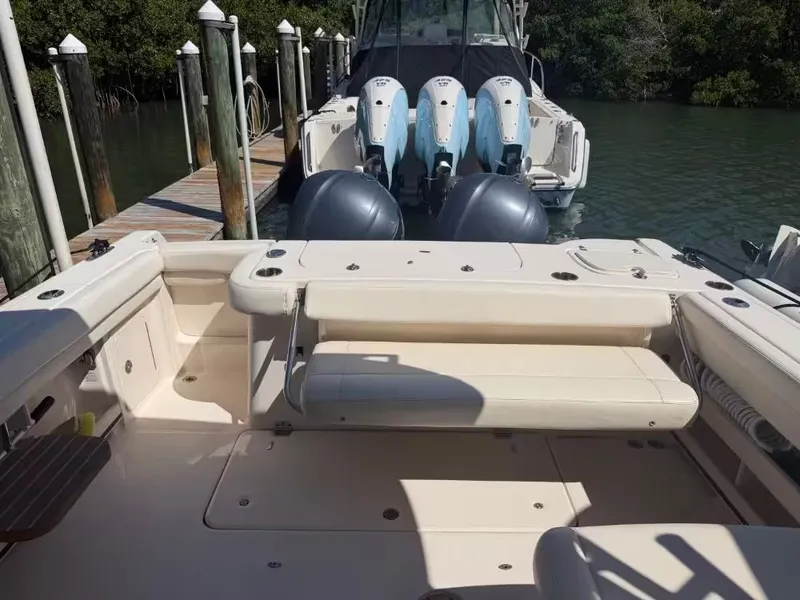 Slide: The Image of Grady-White Freedom 307 boat, 2018 model, docked with outboard engines. - 6