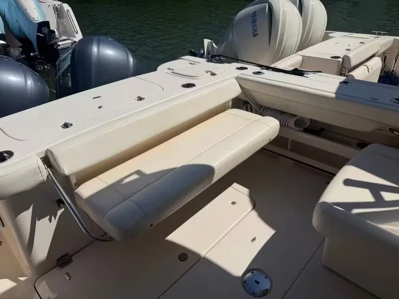Slide: The Image of 2018 Grady-White Freedom 307 boat with seating area and engines. - 7