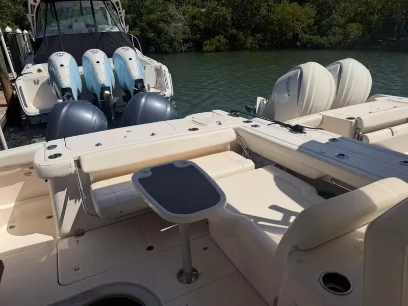 Slide: The Image of 2018 Grady-White Freedom 307 boat with outboard motors at dock. - 8
