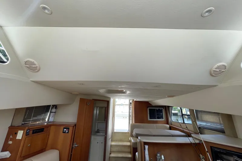 Slide: The Image of Interior of 2002 Silverton 330 Sport Bridge yacht, featuring modern amenities and wood finishes. - 35