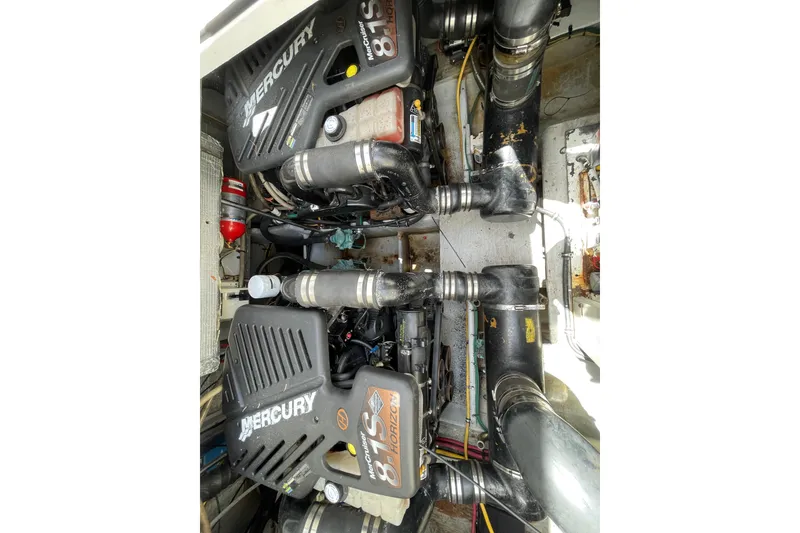 Slide: The Image of Engine room of a 2002 Silverton 330 Sport Bridge with twin Mercury 8.1S Horizon engines. - 43