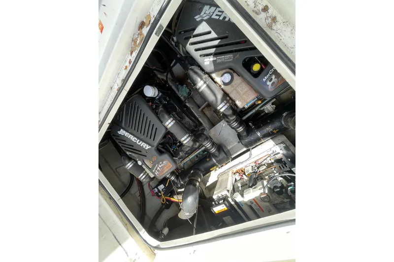 Slide: The Image of Engine compartment of a 2002 Silverton 330 Sport Bridge with Mercury components. - 45