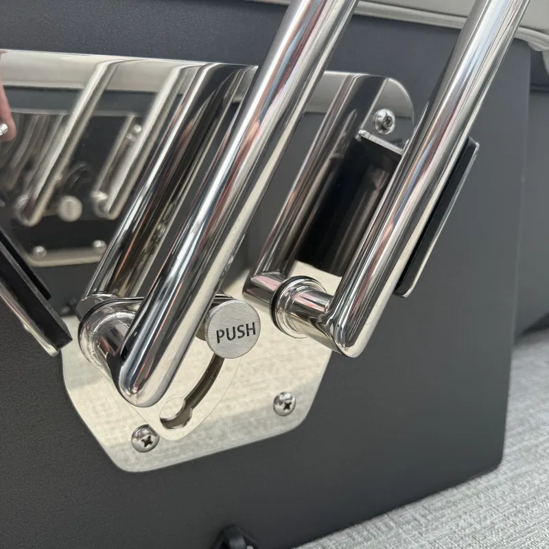 Slide: The Image of Close-up of stainless steel handle with "Push" button on Avalon QLS25T Excalibur 2026. - 13