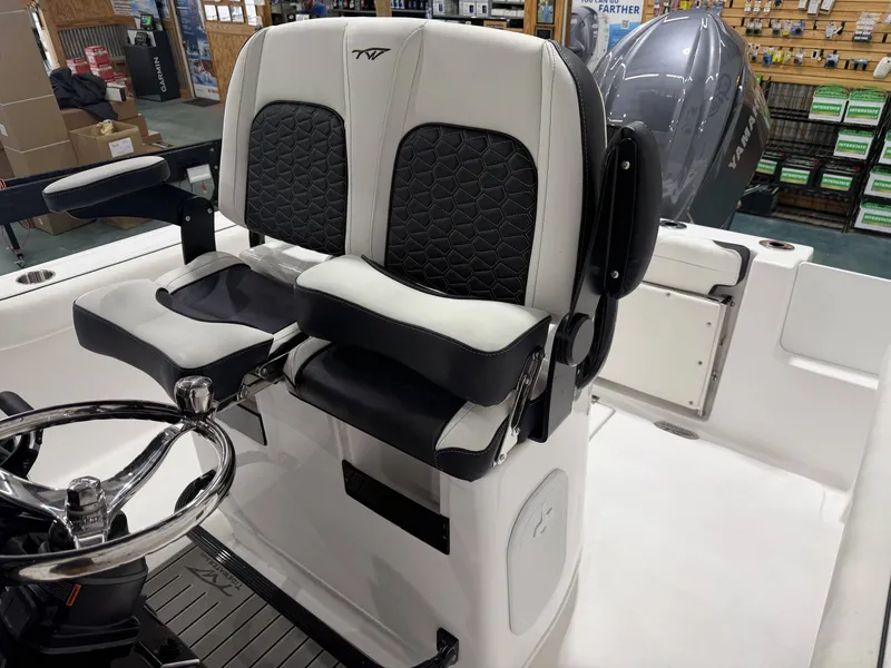 Slide: The Image of 2026 Tidewater 232 CC Adventure boat seats and helm. - 22