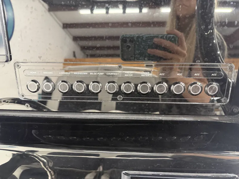 Slide: The Image of Control panel of Tidewater 232 CC Adventure 2026 with various switches. - 25