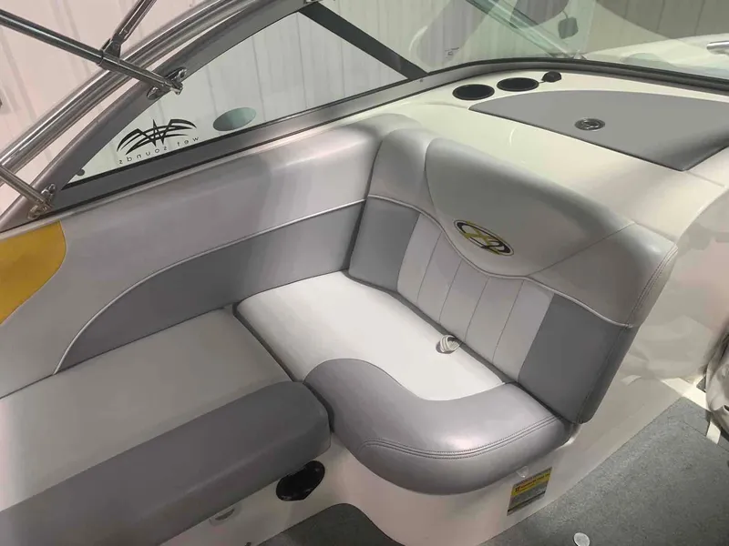 Slide: The Image of Interior of a 2003 MasterCraft X2 boat with gray upholstery. - 11