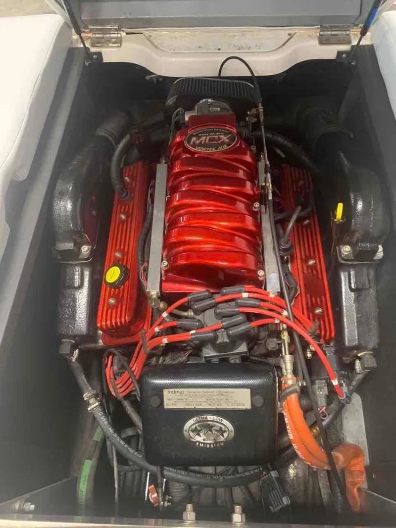 Slide: The Image of Engine of a 2003 MasterCraft X2 boat, painted red. - 12