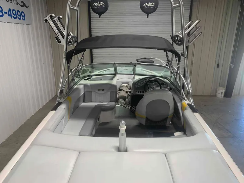 Slide: The Image of Interior view of a 2003 MasterCraft X2 boat in a garage. - 4