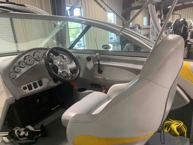 Slide: The Image of Interior of a 2003 MasterCraft X2 boat with steering wheel and dashboard. - 7