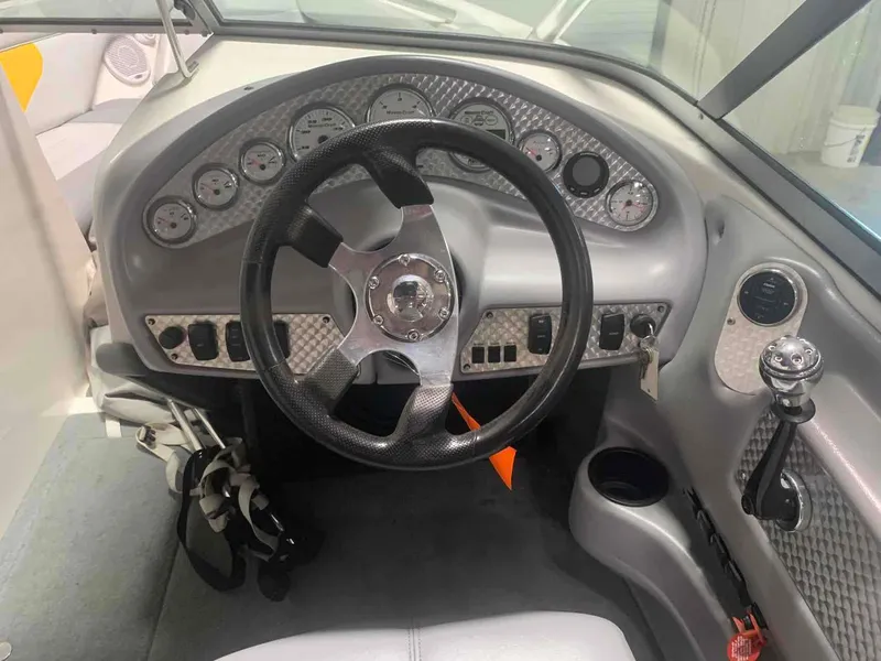 Slide: The Image of Interior view of 2003 MasterCraft X2 boat cockpit with steering wheel and gauges. - 8