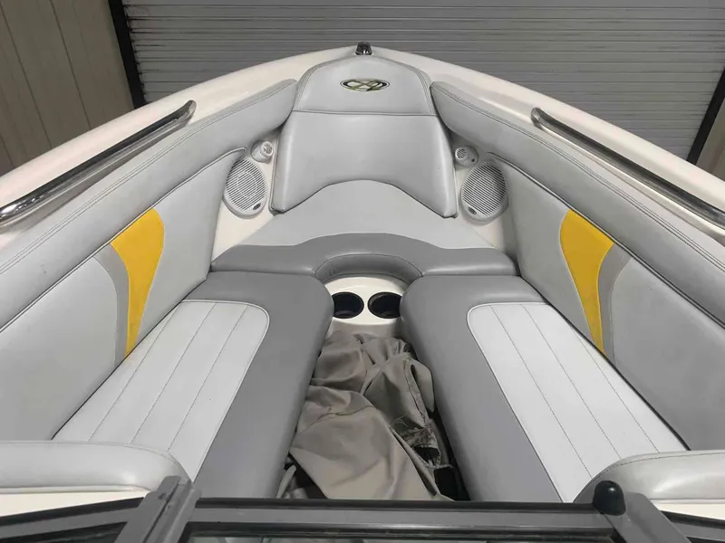 Slide: The Image of Interior of a 2003 MasterCraft X2 boat with gray and yellow seating. - 9