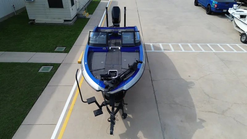 Slide: The Image of Aerial view of a 2025 Vexus DVX22S boat on a parking lot. - 18