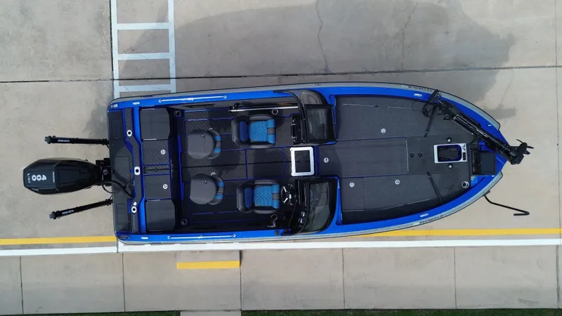 Slide: The Image of Aerial view of 2025 Vexus DVX22S boat on a parking lot. - 19