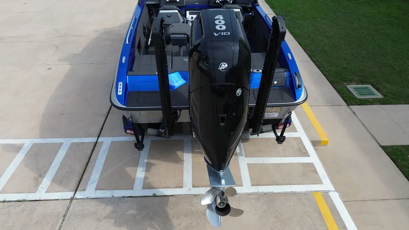 Slide: The Image of Rear view of blue 2025 Vexus DVX22S boat with 400 HP engine. - 24