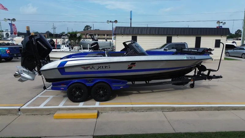 Slide: The Image of 2025 Vexus DVX22S boat on trailer in a parking lot. - 7
