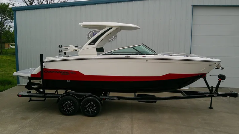 The Image of 2026 Chaparral GTS 28 boat on trailer outside building. - 1