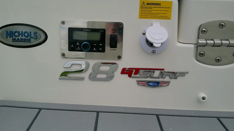 Slide: The Image of 2026 Chaparral GTS 28 boat with control panel and warning label. - 11