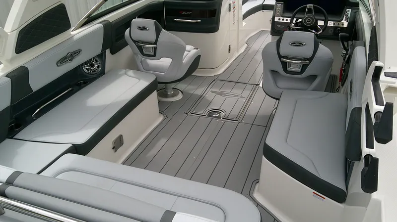 Slide: The Image of Interior of 2026 Chaparral GTS 28 boat with gray seating. - 13