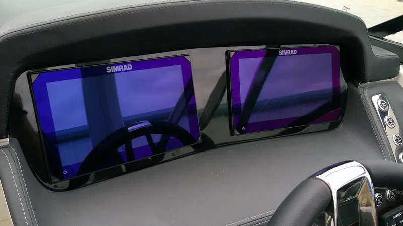 Slide: The Image of 2026 Chaparral GTS 28 dashboard with Simrad screens. - 16