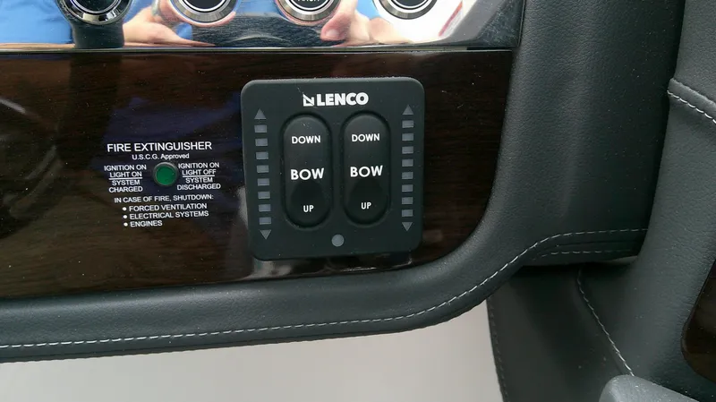 Slide: The Image of 2026 Chaparral GTS 28 control panel with Lenco trim tab controls. - 19