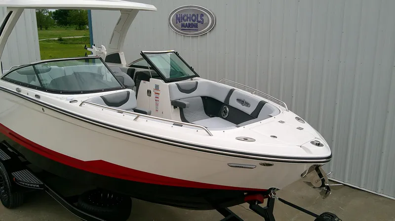 Slide: The Image of 2026 Chaparral GTS 28 boat displayed outside a building. - 5