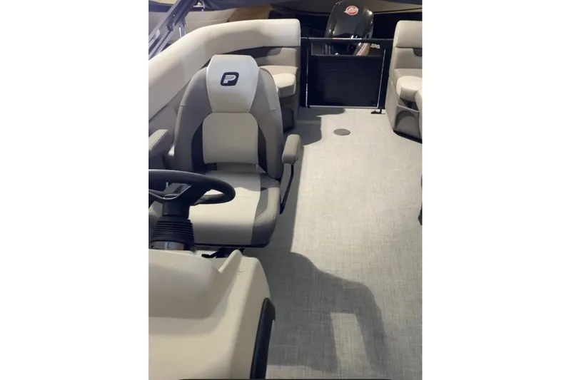 Slide: The Image of Interior of 2026 Princecraft Vectra 23 QL pontoon boat with modern seating and steering. - 10
