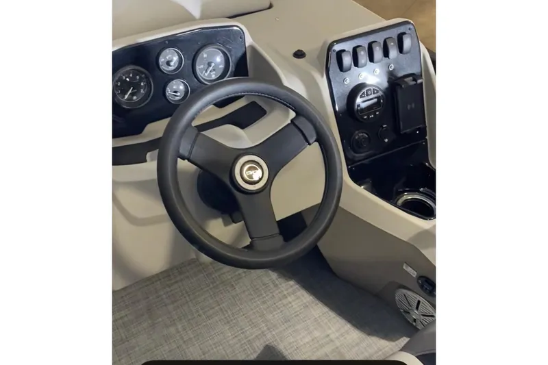Slide: The Image of Steering console of 2026 Princecraft Vectra 23 QL boat with gauges and controls. - 13