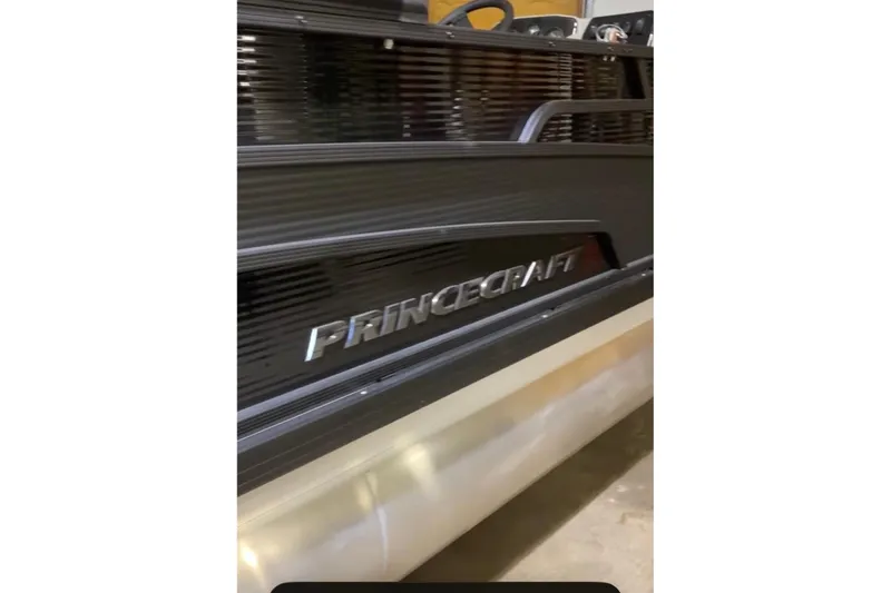 Slide: The Image of 2026 Princecraft Vectra 23 QL boat, sleek black exterior with logo detail. - 5