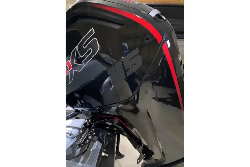 Slide: The Image of 2026 Princecraft Vectra 23 QL boat engine with sleek black and red design. - 7