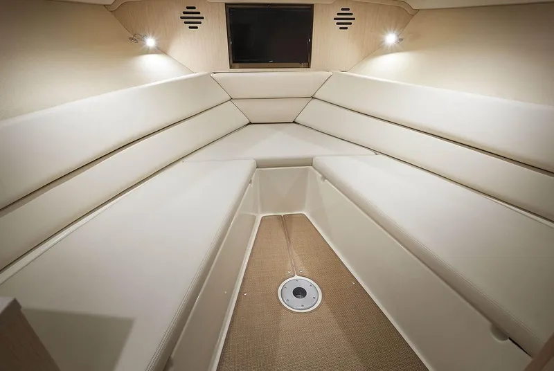 Slide: The Image of Manufacturer Provided Image: Interior cabin of 2020 Chris-Craft Corsair 34 with beige seating and lighting. - 11