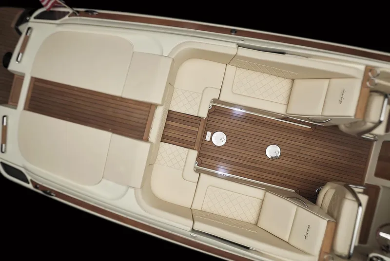 Slide: The Image of Manufacturer Provided Image: 2020 Chris-Craft Corsair 34 interior with luxurious seating and wooden deck. - 6