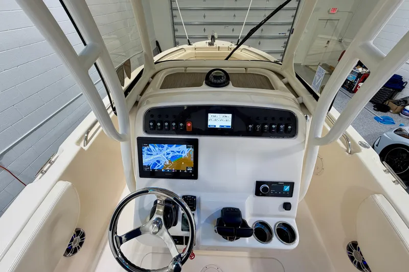 Slide: The Image of 2023 Grady-White Fisherman 257 boat dashboard with navigation and control systems. - 10