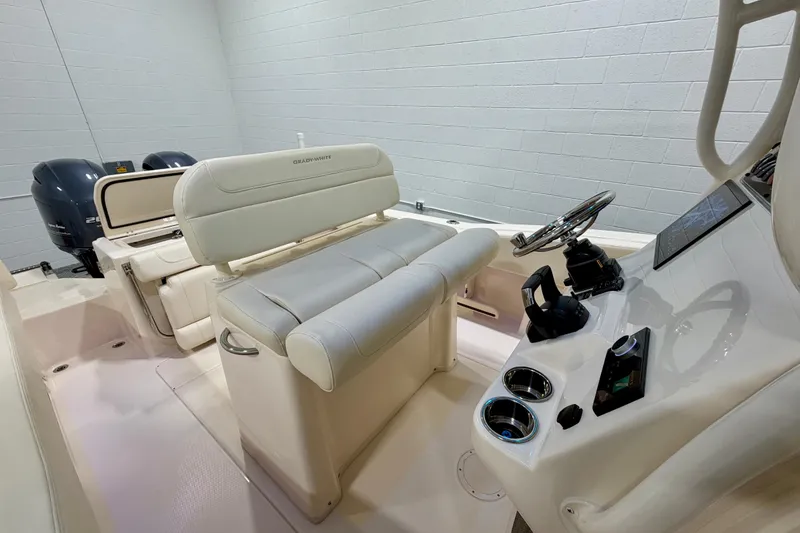 Slide: The Image of 2023 Grady-White Fisherman 257 boat interior with helm and seating area. - 13