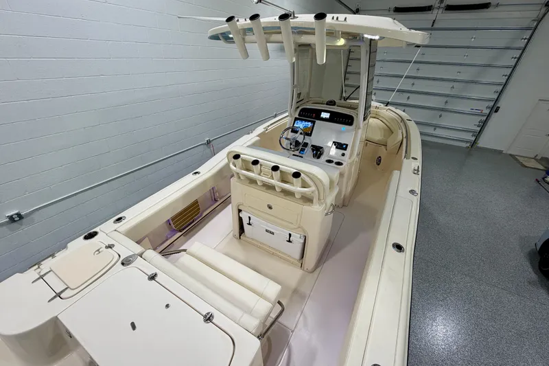 Slide: The Image of 2023 Grady-White Fisherman 257 boat interior with helm, seating, and fishing rod holders. - 16