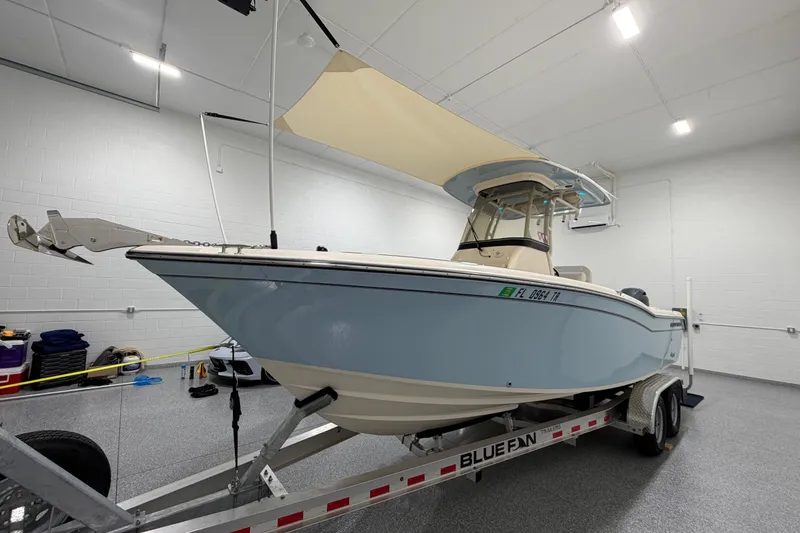 Slide: The Image of 2023 Grady-White Fisherman 257 boat on trailer in a well-lit garage. - 3
