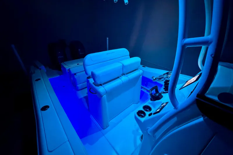 Slide: The Image of 2023 Grady-White Fisherman 257 boat interior illuminated with blue lighting. - 30