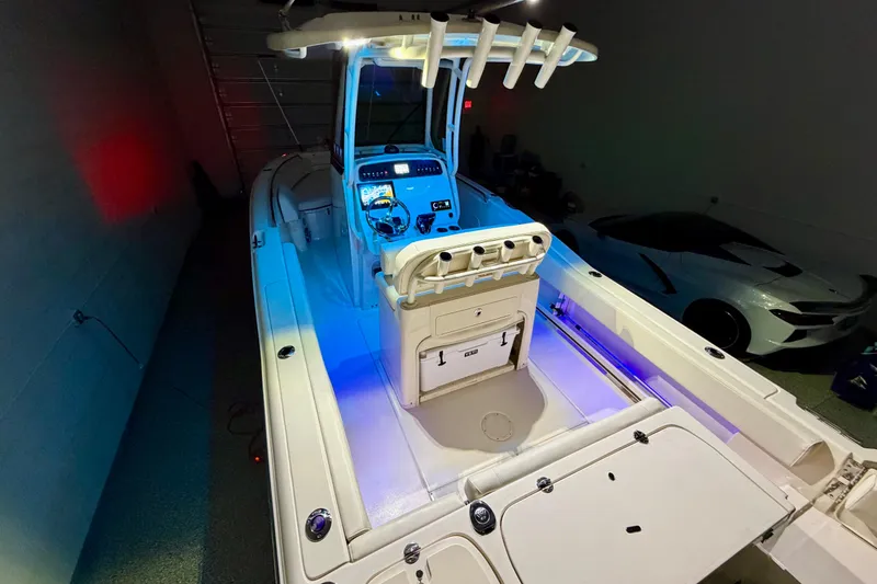Slide: The Image of 2023 Grady-White Fisherman 257 boat interior with illuminated console and seating area. - 31