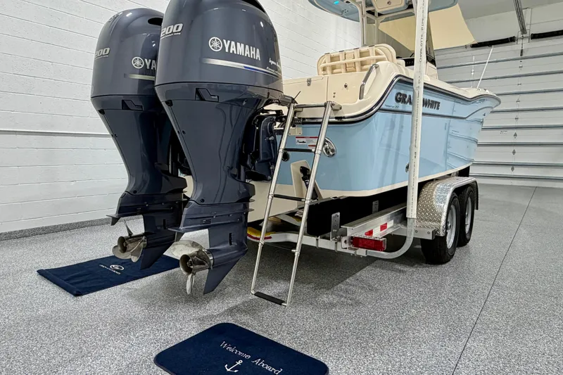 Slide: The Image of 2023 Grady-White Fisherman 257 boat with dual Yamaha engines on a trailer. - 32
