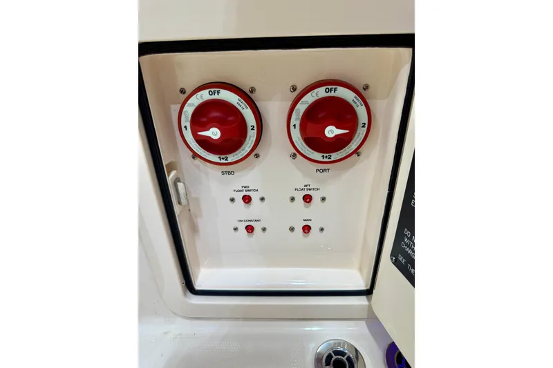 Slide: The Image of Control panel of 2023 Grady-White Fisherman 257 boat with switches and dials. - 34