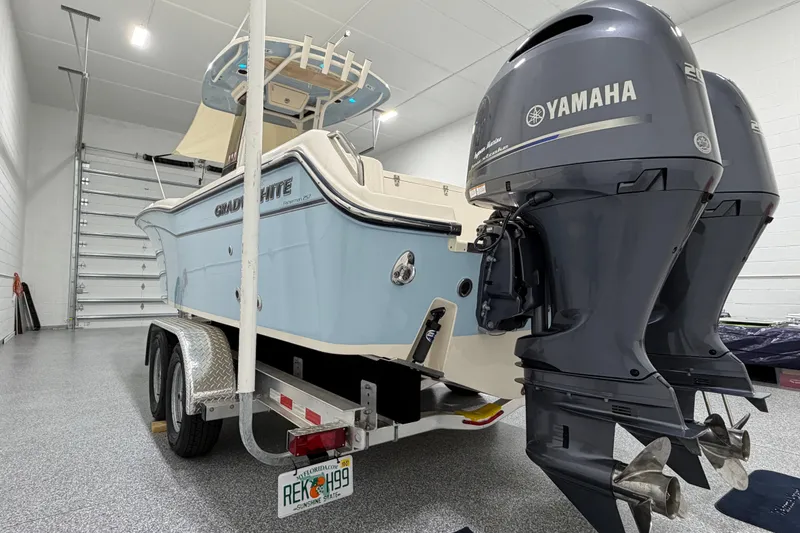 Slide: The Image of 2023 Grady-White Fisherman 257 boat with Yamaha engines in a garage. - 4