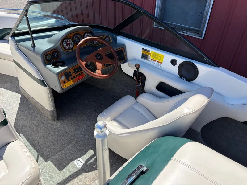 Slide: The Image of Interior of a 1997 MasterCraft Prostar 205 boat with steering wheel and dashboard. - 12