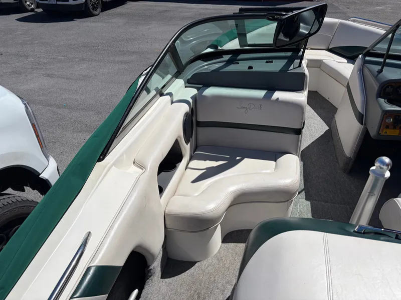 Slide: The Image of Interior of a 1997 MasterCraft Prostar 205 boat with white seating. - 13