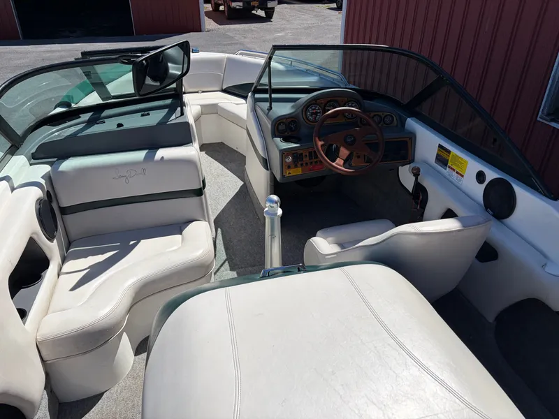 Slide: The Image of Interior of a 1997 MasterCraft Prostar 205 boat with steering wheel and seats. - 14