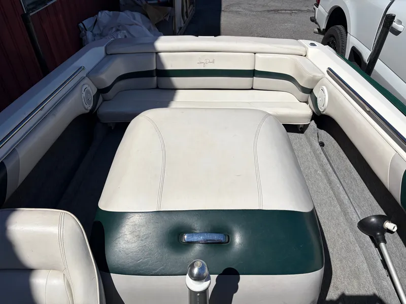 Slide: The Image of Interior of a 1997 MasterCraft Prostar 205 boat with white seating. - 16