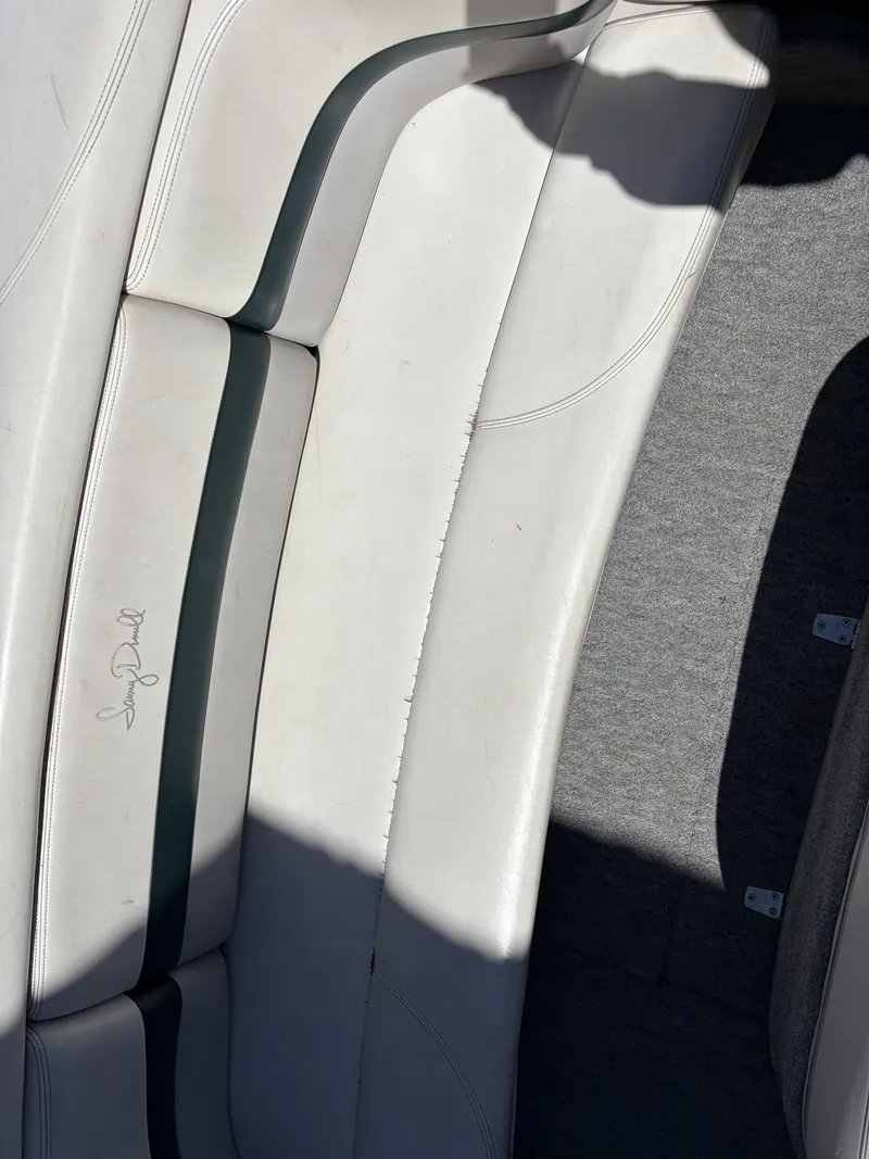 Slide: The Image of Interior of a 1997 MasterCraft Prostar 205 boat with white seats. - 6