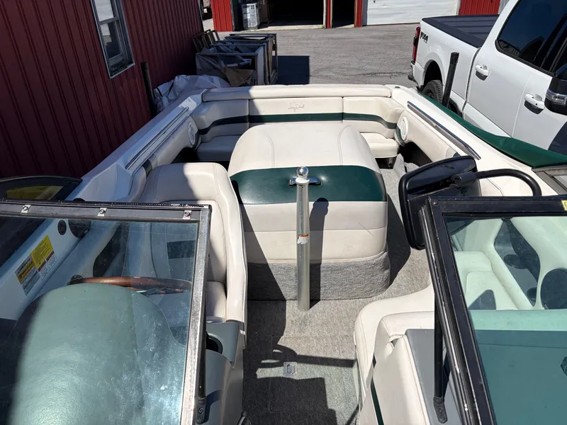 Slide: The Image of Interior of a 1997 MasterCraft Prostar 205 boat, white and green upholstery. - 9