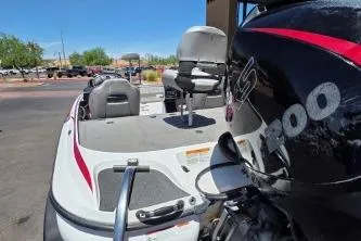 Slide: The Image of 2019 Nitro Z19 Pro boat with powerful engine, parked outdoors under clear blue sky. - 3
