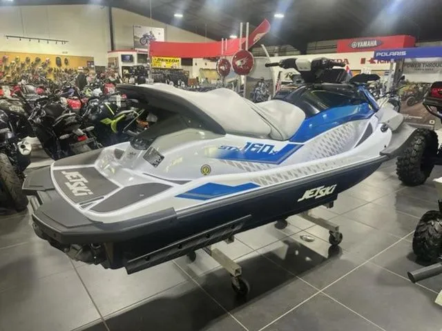 Slide: The Image of 2026 Kawasaki Jet Ski STX 160 X in showroom. - 3
