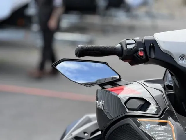 Slide: The Image of Close-up of 2026 Kawasaki Ultra 160 handlebar and mirror. - 22